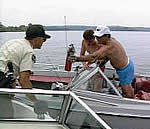 Boating officer checking boaters for proper safety equipment
